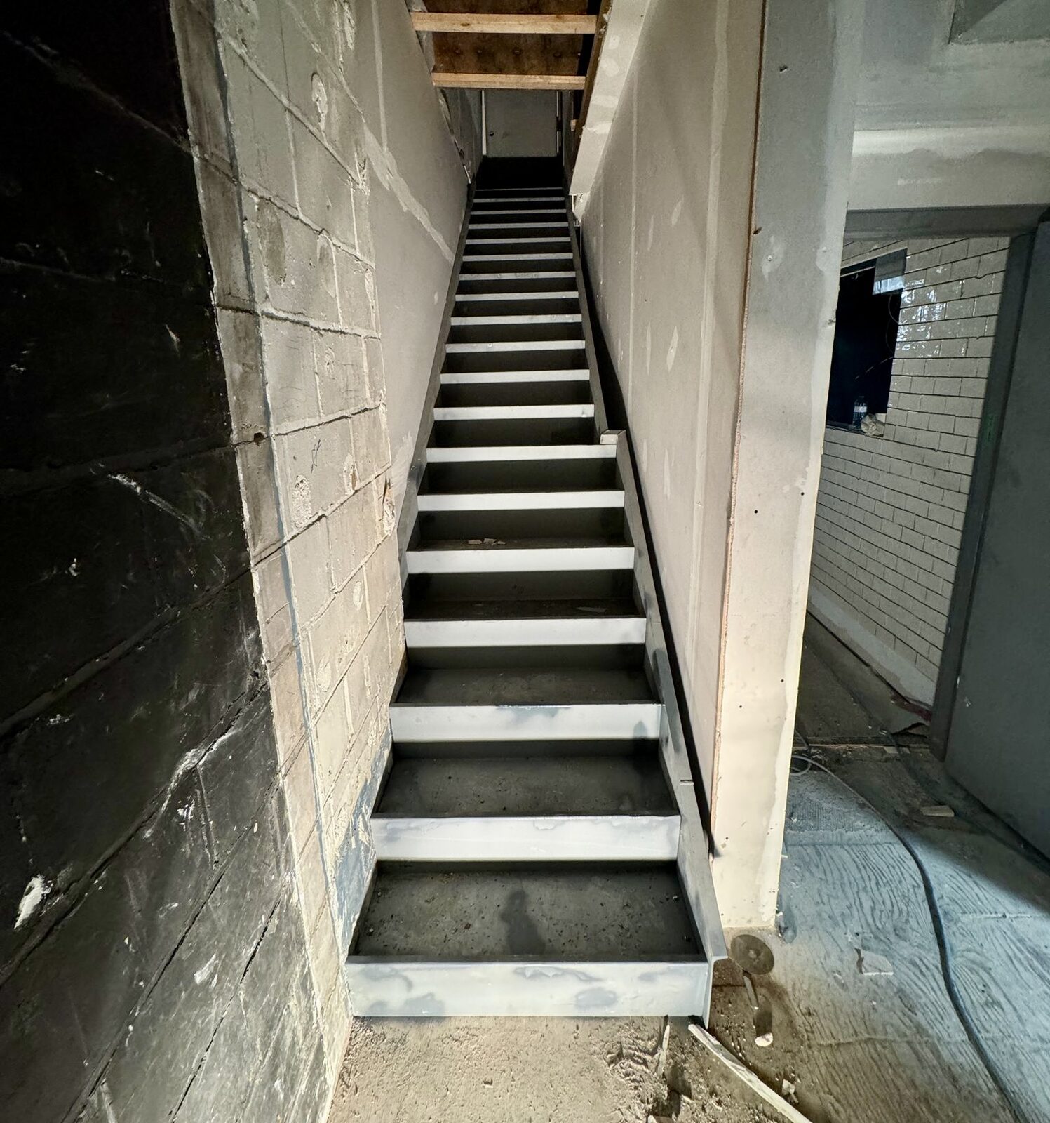 Custom steel staircase and landing framing by Weld Plus