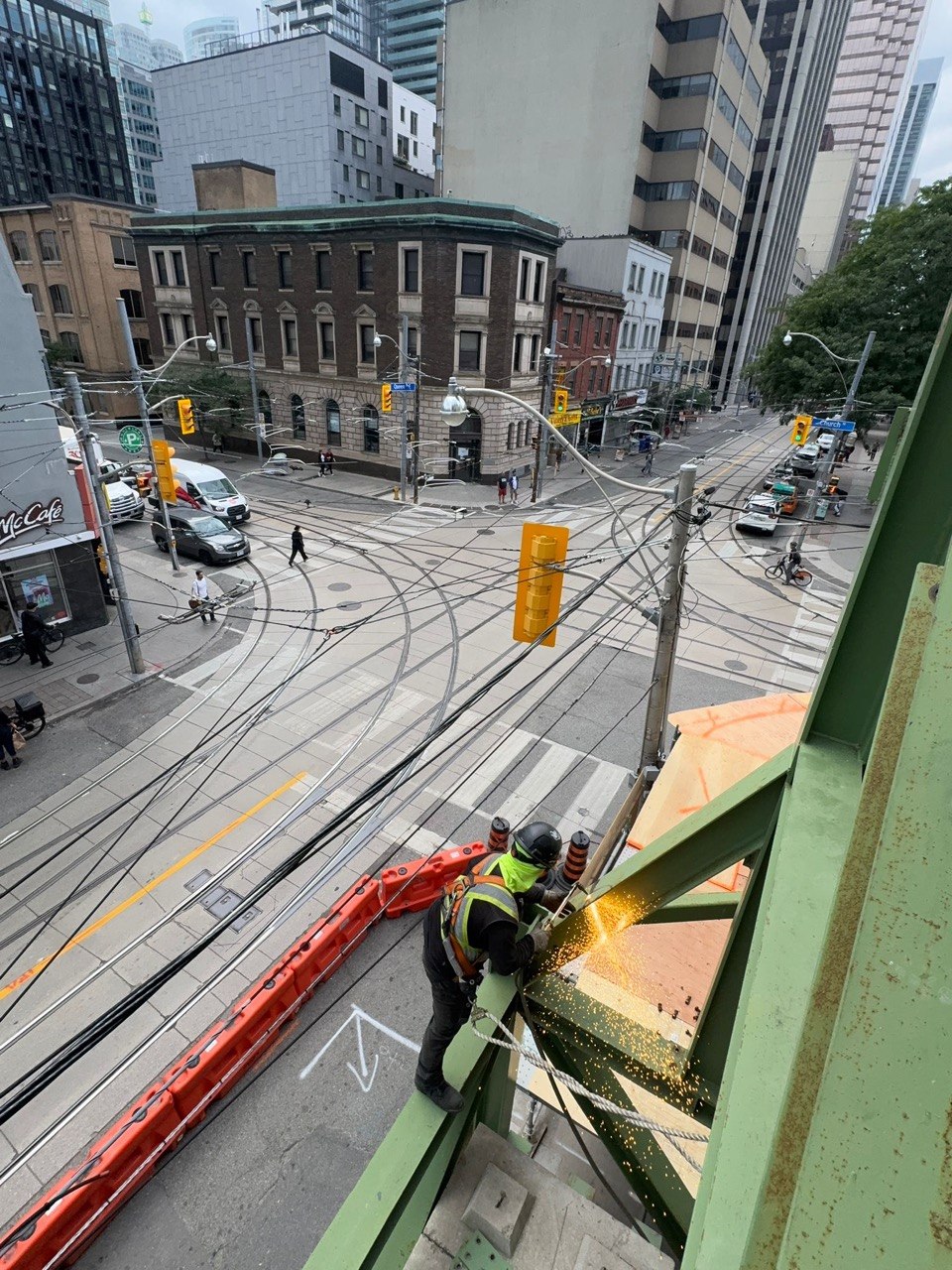 Heritage masonry facade retained by a temporary structural steel frame, downtown Toronto
